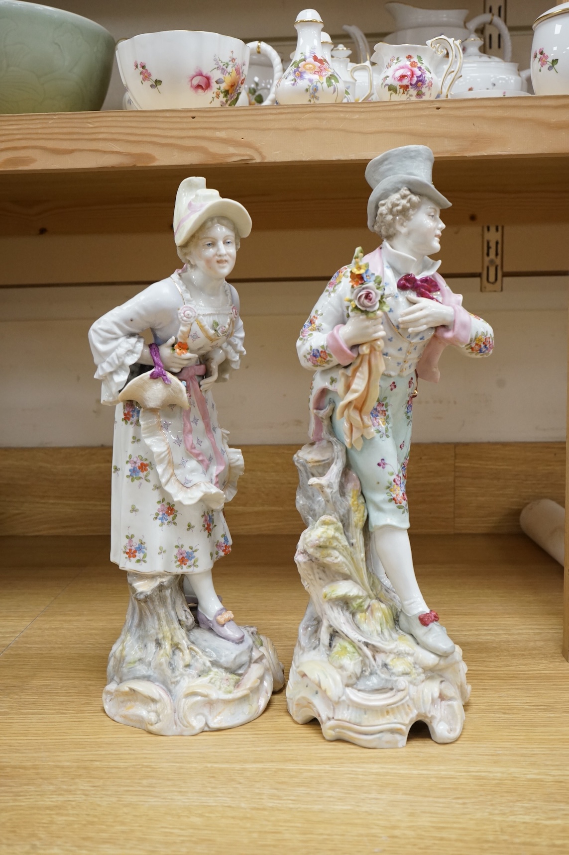 A pair of large Continental porcelain figures of a lady and gentleman, late 19th century, 41cm high